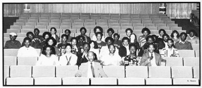 Human Relations council posing for a picture in the late 1970's in an auditorium